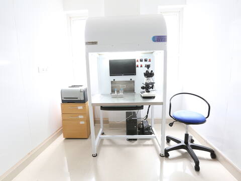 The andrology lab at Jananam Fertility Centre, Neelankarai: a laminar-flow workstation with a microscope and a monitor