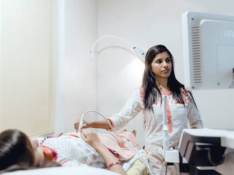 A follicle-tracking scan in progress at Jananam Fertility Centre, the doctor watching the screen as she scans
