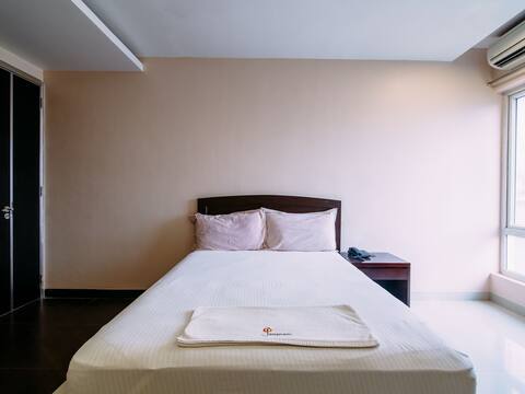 On-site patient room with a bed and window at Jananam Fertility Centre, Neelankarai